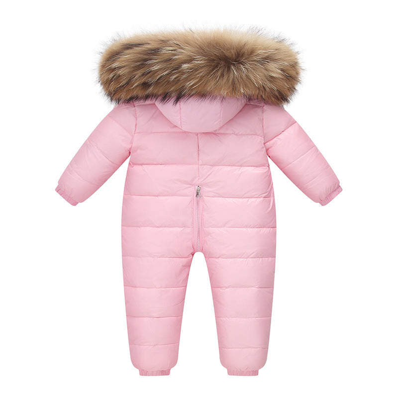 The Baby Wears White Eiderdown Over A Onesie And Down Jacket