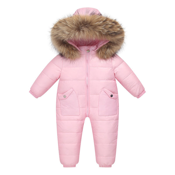 The Baby Wears White Eiderdown Over A Onesie And Down Jacket